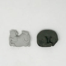 Load image into Gallery viewer, One black and one grey cat shaped eraser laying flat on an all white surface
