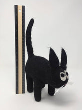 Load image into Gallery viewer, Picture of a black felt cat toy standing on a white surface with a ruler behind it
