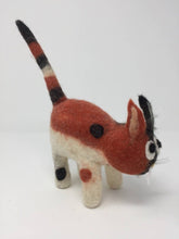 Load image into Gallery viewer, Orange, white, and black felt cat toy standing on a white surface showcasing the side of the cat
