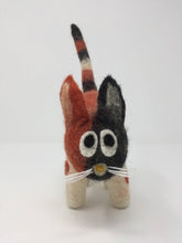 Load image into Gallery viewer, Orange, white, and black felt cat toy standing on a white surface facing front
