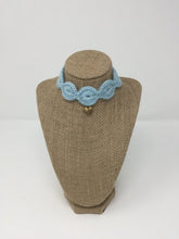 Load image into Gallery viewer, Picture of a light blue pet collar with a gold colored pendant around a tan brown bust 
