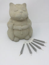 Load image into Gallery viewer, Picture of six rolled up joints filled with catnip in front of a cat sitting in a Buddha like position
