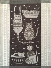 Load image into Gallery viewer, Close up picture of a black and grey cat-themed kitchen towel 

