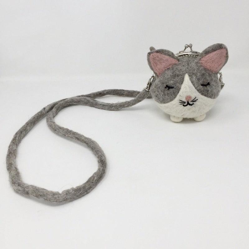 Picture of grey and white mini cat purse on white background 