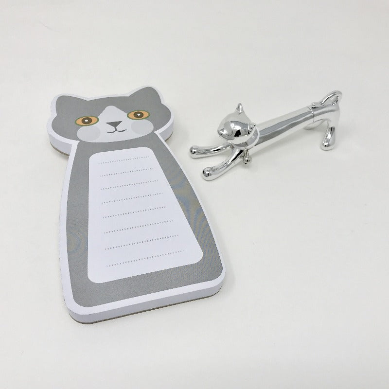 Picture of grey and white cat-themed notepad with metallic silver cat pen