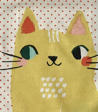 Load image into Gallery viewer, Close up picture of a white kitchen towel with red dots and two big yellow cats on it hanging from a white kitchen cupboard
